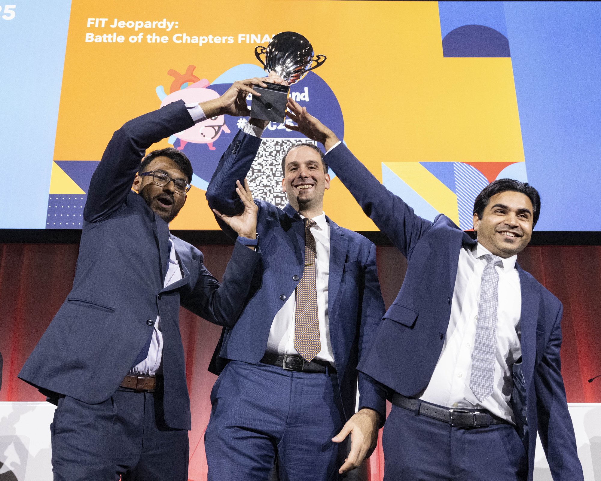 3 men holding a trophy after winning FIT Jeopardy 3 men holding a trophy after winning FIT Jeopardy